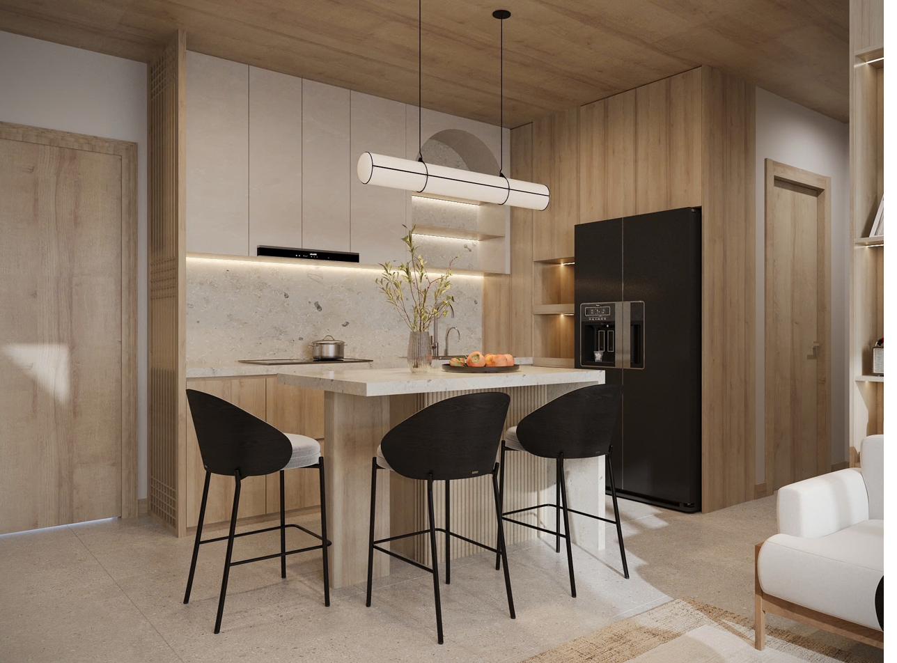 Travertine kitchen island with three counter stools under a linear pendant